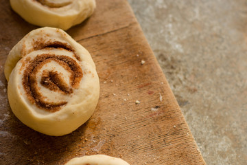 cinnamon buns - Cinnabon cooking process raw dough. (food background). copy space
