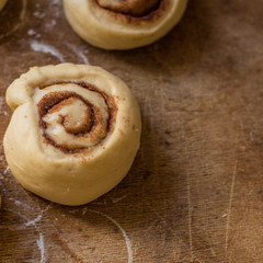 cinnamon buns - Cinnabon cooking process raw dough. (food background). copy space