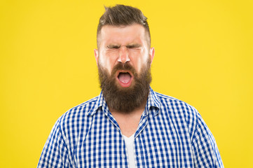 Man bearded hipster with sneezing face closed eyes close up yellow background. Brutal hipster sneezing. Allergy concept. Take allergy medications. Can not stop sneezing. I am going to sneeze