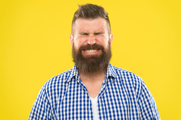 Obraz premium Just sneezed. Man bearded hipster with sneezing face closed eyes close up yellow background. Brutal hipster sneezing. Allergy season concept. Take allergy medications. Can not stop sneezing