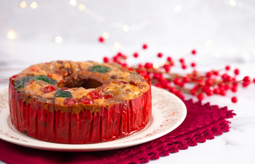 A Round Fruit Cake with Cherries Pineapples and Nuts Elegant Platter