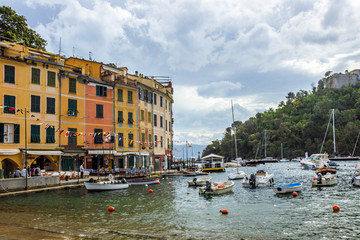 Fototapeta premium beach streets and colorful houses on the hill in Portofino in Liguria in Italy 