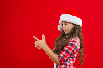 Little girl child in santa hat. Christmas shopping. Happy winter holidays. Small girl. Present for Xmas. Childhood. New year party. Santa claus kid. playing kid. All I want for Christmas