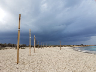 A mediterranean beach on a cloudy day