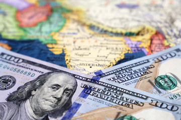 US dollars on the map of South-East Asia. American investment and trading with India and asian countries, concept of american policy and influence