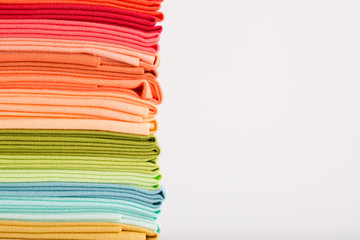 Fabric, pile of colorful cotton fabric isolated on white background, copy space