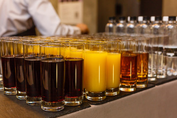 glass cups with drinks on the buffet table