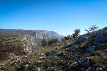 Fototapeta na wymiar Scenic landscape of South Coast of Crimea with cliffs and autumn forest, Russia