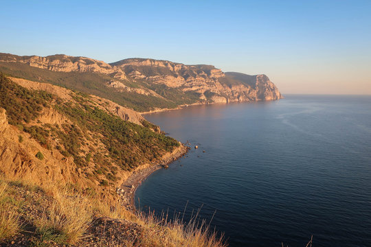 Scenery of South Coast of Crimea, endless Black Sea and rocky cliffs, Russia