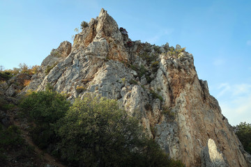 Scenic landscape of South Coast of Crimea with cliffs and autumn forest, Russia