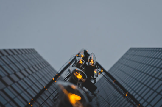 The Holiday Lights On The Edge Of The Glass Building In The City. 