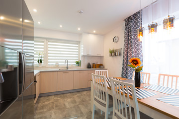 Modern kitchen interior with dining table