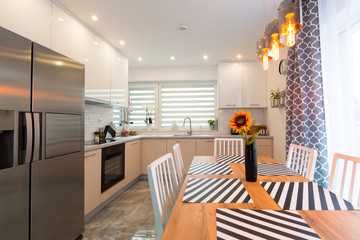 Modern kitchen interior with dining table