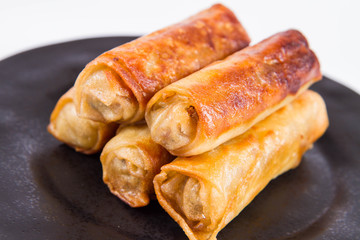 Chinese Traditional Spring roll with sweet and sour sauce eaten with a fork