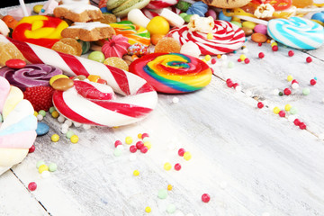 Fototapeta premium candies with jelly and sugar. colorful array of different childs sweets and treats.