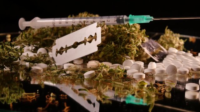 Cannabis, coke, razorblades, drugs, pills, XTC and needle rotating