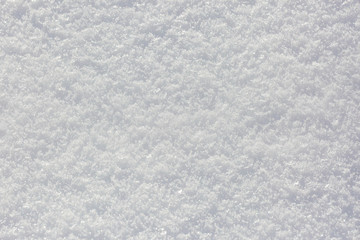 Snow texture and background in a sunny winter day