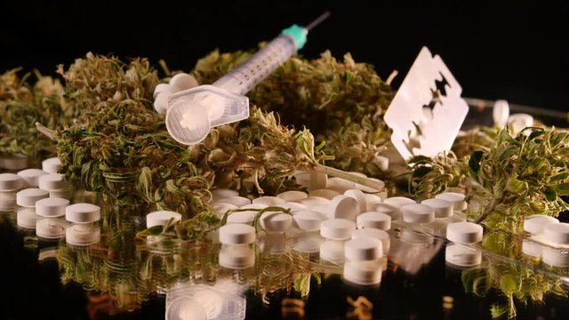 Cannabis, coke, razorblades, drugs, pills, XTC and needle rotating