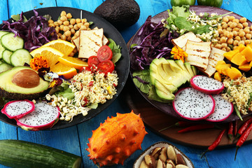 grilled tofu and dragon fruit buddha bowl with vegetable and humus