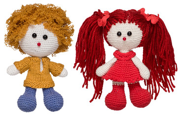 Handmade knitted dolls. Isolated on white background.