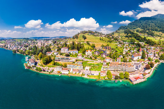 Village Weggis, lake Lucerne (Vierwaldstatersee), Rigi mountain and Swiss Alps in the background near famous Lucerne city, Switzerland