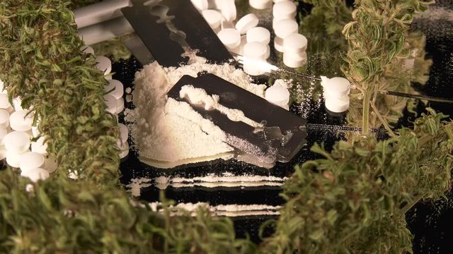 Cannabis, coke, razorblades, drugs, pills, XTC and needle rotating