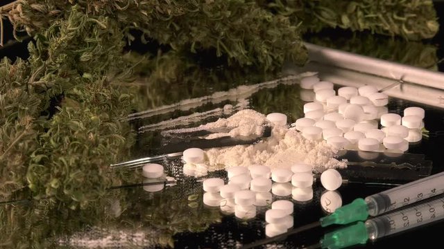 Cannabis, coke, razorblades, drugs, pills, XTC and needle rotating