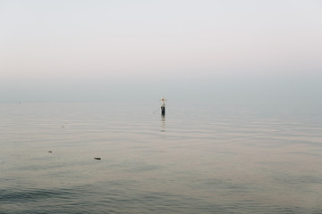 Fototapeta na wymiar single buoy on a calm ocean