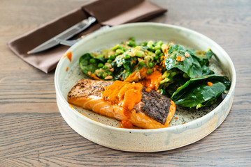 salmon steak with salad