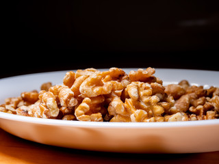A plate of peeled nuts. Close view