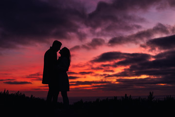 sunset at Bali, Indonesia. couple kissing