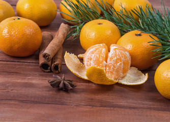 mandarins with fir tree branches, star anise cinnamon. Christmas concept