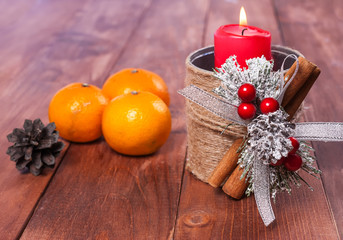 Mandarins and candles on the table