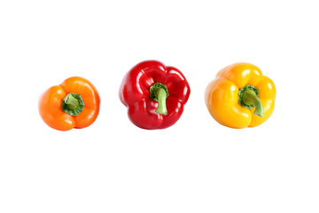 Orange, red and yellow sweet paprika isolated on white