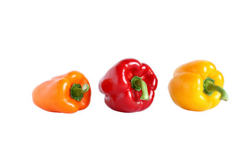 Orange, red and yellow sweet paprika isolated on white
