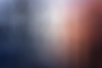 light abstraction on corrugated glass in the form of a beautiful bokeh. Reflex glass. Carbon texture.