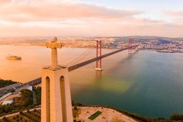 Aerial view of the 25 April bridge is a steel suspension bridge located in Lisbon, Portugal, crossing the Targus river. It is one of the most famous landmarks of the region. 