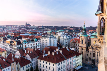 Obraz premium View on Prague panorama with red roofs and historic architecture