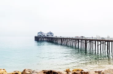 Fotobehang Malibu foggy pier in Southern California, Pacific coast, USA. View on the Pacific Ocean. Copy space for text. © ggfoto