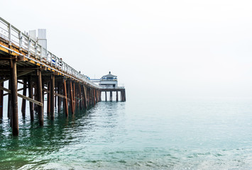 Malibu pier in Southern California, Pacific coast, USA. View on the Pacific Ocean. Copy space for text.