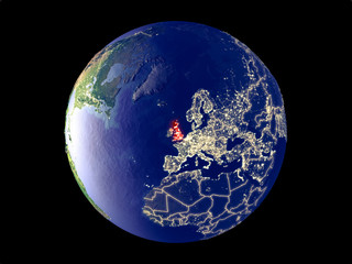 United Kingdom from space on model of planet Earth with city lights. Very fine detail of the plastic planet surface and cities.