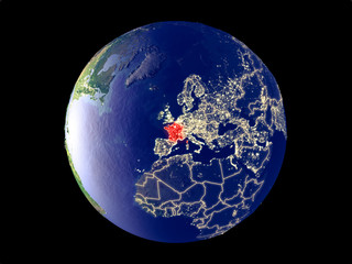 France from space on model of planet Earth with city lights. Very fine detail of the plastic planet surface and cities.