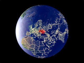 Ukraine from space on model of planet Earth with city lights. Very fine detail of the plastic planet surface and cities.