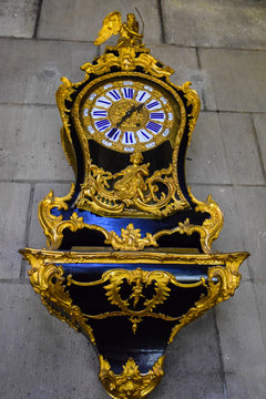 Ornate gold and blue clock in the Treasure Room in Notre Dame Cathedral in Paris