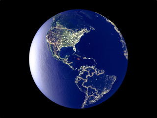 Jamaica from space on model of planet Earth with city lights. Very fine detail of the plastic planet surface and cities.