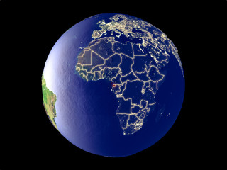 Equatorial Guinea from space on model of planet Earth with city lights. Very fine detail of the plastic planet surface and cities.