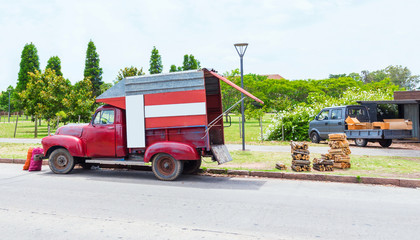 Red truck on the road, Montevideo, Uruguay, USA. Copy space for text.