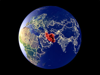 Iran from space on model of planet Earth with city lights. Very fine detail of the plastic planet surface and cities.