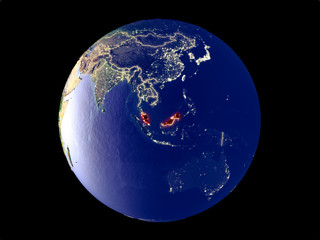 Malaysia from space on model of planet Earth with city lights. Very fine detail of the plastic planet surface and cities.