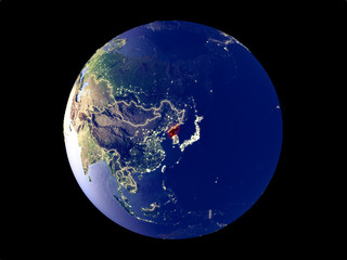 North Korea from space on model of planet Earth with city lights. Very fine detail of the plastic planet surface and cities.